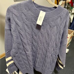 Women’s cable knit sweater